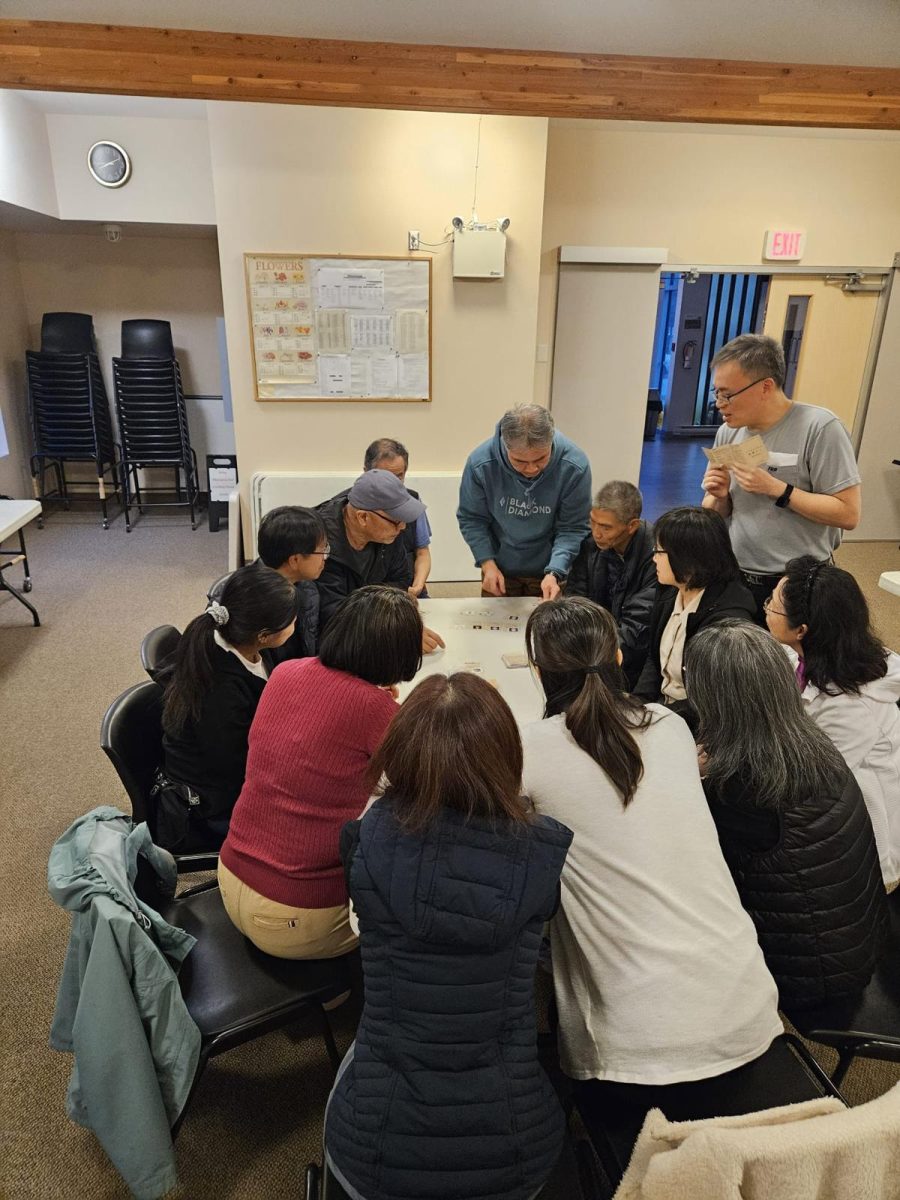 Enoch Fellowship members playing board games together