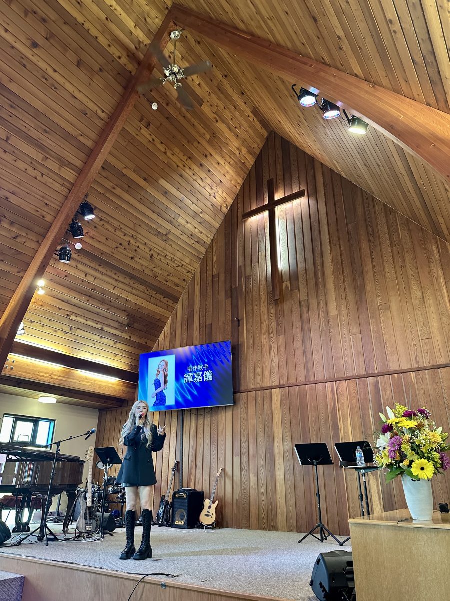 Singer-songwriter performing at an evangelistic event