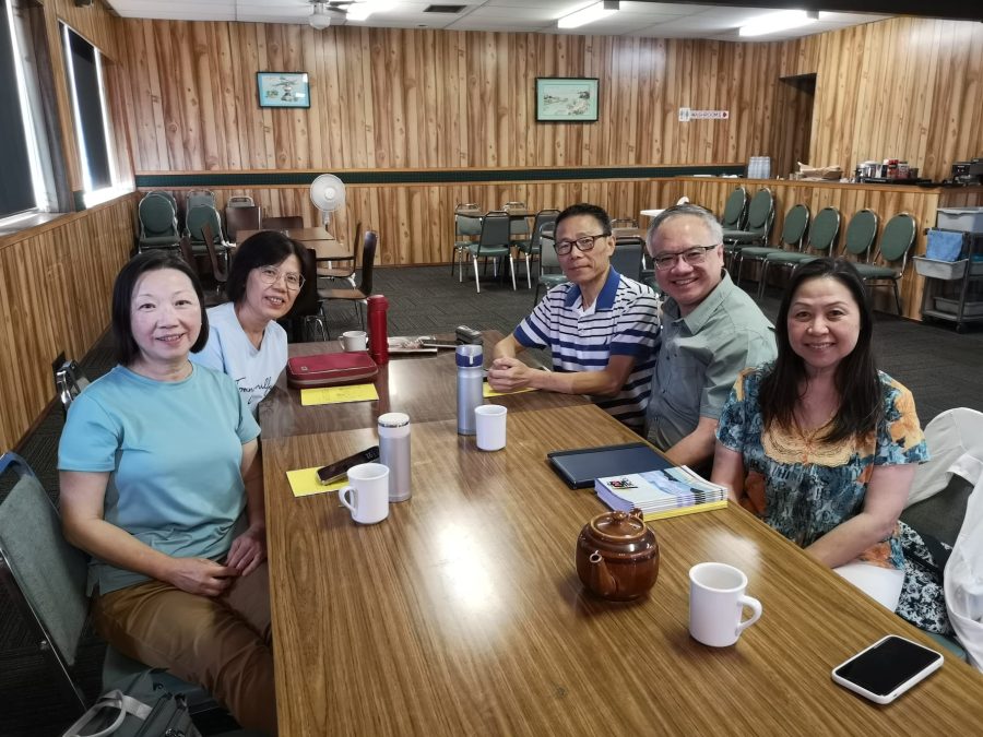 Team members gathering for fellowship and sharing